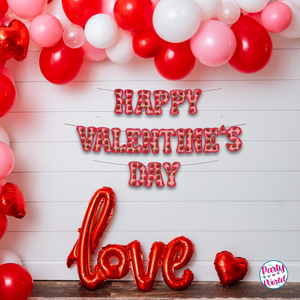  Festive Valentine's Day decorations featuring a paper banner with faux strawberry crochet letters