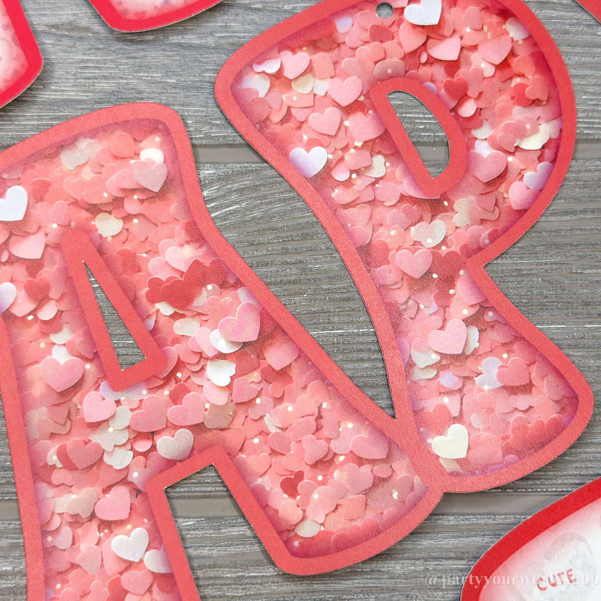 Happy Valentine's Day paper banner with faux pink heart glitter letters, spreading love and joy.